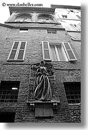 black and white, bricks, bronze, europe, italy, sculptures, siena, statues, towns, tuscany, vertical, walls, photograph