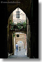 archways, cobblestones, europe, italy, men, narrow streets, siena, streets, towns, tuscany, vertical, walking, photograph