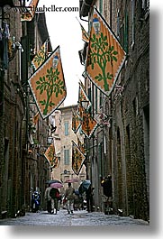 cobblestones, europe, flags, italy, narrow streets, people, siena, streets, towns, tuscany, vertical, walking, photograph