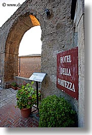 archways, europe, fortezza, fortress, hotels, italy, plants, signs, sorano, towns, tuscany, vertical, photograph