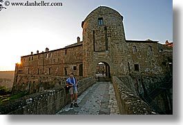 cobblestones, europe, fortress, horizontal, italy, people, sorano, sunsets, tourists, towns, tuscany, womens, photograph