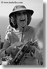 black and white, dorothy, europe, glasses, happy, hats, italy, malutta, playing, sunglasses, tamborine, tourists, tuscany, vertical, womens, photograph