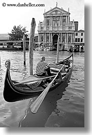 black and white, boats, buildings, canals, europe, gondolas, gondolier, italy, men, venecia, venezia, venice, vertical, photograph