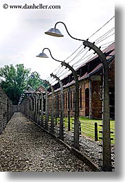 auschwitz, barbed, barbed wire, buildings, europe, fences, lights, poland, prison, prison camp, structures, vertical, wires, photograph