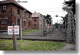 arts, auschwitz, barbed, barbed wire, bricks, buildings, design, europe, fences, horizontal, materials, poland, prison, prison camp, signs, structures, warning, wires, photograph