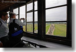 auschwitz, buildings, europe, from, guards, horizontal, men, military, poland, prison, prison camp, structures, towers, viewing, windows, photograph