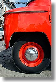 cars, colors, communist, europe, krakow, poland, red, transportation, vertical, wheels, photograph
