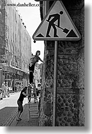 black and white, emotions, europe, humor, krakow, ladder, people, poland, signs, vertical, womens, photograph