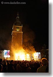 bell towers, buildings, clock tower, crowds, europe, fire, krakow, nite, people, performance, poland, smoke, structures, vertical, photograph