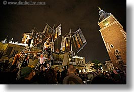 bell towers, buildings, clock tower, crowds, europe, horizontal, krakow, metalic, nite, people, performance, poland, sailing, ships, structures, photograph