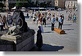 crowds, europe, horizontal, krakow, men, nuns, people, performance, poland, wheel chair, photograph