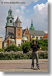 bell towers, buildings, clothes, emotions, europe, krakow, palace, people, poland, shirts, smiles, somafm, structures, sunglasses, vertical, wawel castle, womens, photograph