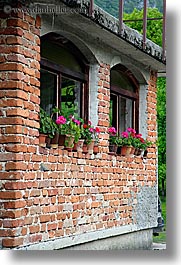 bohinj, bricks, europe, flowers, geraniums, pink, slovenia, vertical, windows, photograph