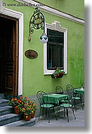 cafes, europe, flowers, green, lamp posts, ljubljana, slovenia, vertical, walls, windows, photograph