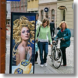 bicycles, europe, humor, ljubljana, people, posters, slovenia, square format, womens, photograph