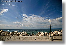 clouds, europe, horizontal, lamp posts, ocean, pirano, shoreline, slovenia, sunbathers, water, photograph