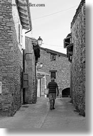 black and white, estamariu, europe, men, spain, streets, vertical, walking, photograph