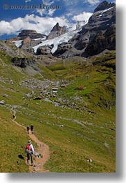 clouds, europe, hikers, hiking, kandersteg, lake oeschinensee, mountains, nature, people, sky, snowcaps, switzerland, vertical, photograph