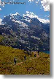 clouds, europe, hikers, hiking, kandersteg, lake oeschinensee, mountains, nature, people, sky, snowcaps, switzerland, vertical, photograph