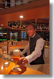 bartender, beers, emotions, europe, kandersteg, men, people, serving, smiles, switzerland, vertical, wald hotel doldenhorn, photograph