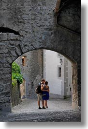archways, chateau de chillon, couples, europe, kissing, men, montreaux, people, switzerland, under, vertical, womens, photograph