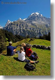 europe, groups, hikers, men, mountains, murren, nature, people, picnic, snowcaps, switzerland, vertical, womens, photograph