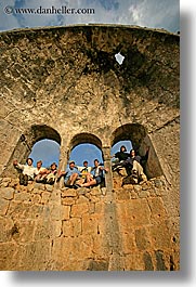 arches, architectural ruins, europe, groups, hands, happy, laugh, people, tourists, tours, turkeys, vertical, windows, photograph