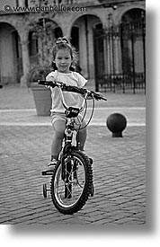 bicycles, black and white, caribbean, childrens, cuba, girls, havana, island nation, islands, latin america, people, south america, vertical, photograph