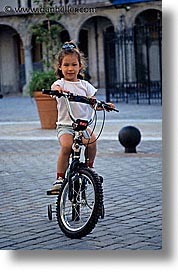 bicycles, caribbean, childrens, cuba, girls, havana, island nation, islands, latin america, people, south america, vertical, photograph
