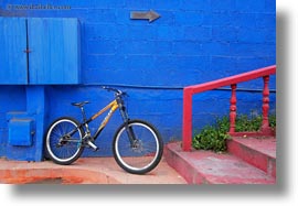 bicycles, blues, ecuador, equator, galapagos islands, horizontal, latin america, puerto ayora, railing, red, santa cruz, walls, yellow, photograph