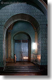 archways, buildings, candles, churches, doors, ecuador, equator, latin america, materials, praying, quito, religious, slow exposure, structures, vertical, womens, woods, photograph
