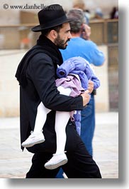 carrying, clothes, girls, hats, israel, jerusalem, jewish, men, middle east, people, religious, vertical, photograph