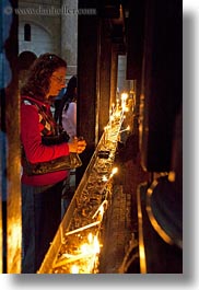 buildings, candles, catholic, churches, glow, holy sepulchre, israel, jerusalem, lighting, lights, middle east, religious, religious sites, structures, vertical, womens, photograph