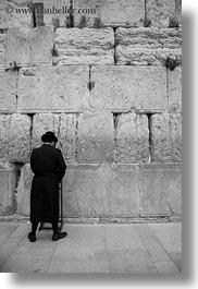 black and white, clothes, hats, israel, jerusalem, jewish, men, middle east, praying, religious, temples, vertical, walls, western wall, photograph