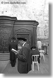 black and white, clothes, hats, israel, jerusalem, jewish, men, middle east, praying, religious, temples, vertical, western wall, photograph