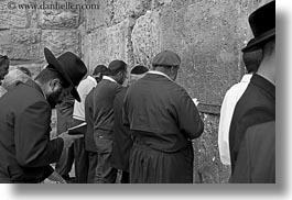 beards, black and white, clothes, hats, horizontal, israel, jerusalem, jewish, men, middle east, people, praying, religious, temples, walls, western, western wall, photograph