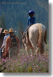 activities, america, boys, childrens, clothes, hats, helmets, horseback riding, horses, idaho, jacks, north america, people, red horse mountain ranch, riding, united states, vertical, photograph