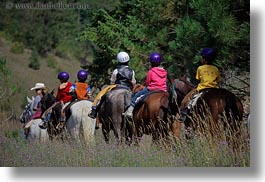 activities, america, boys, childrens, clothes, hats, helmets, horizontal, horseback riding, horses, idaho, north america, people, red horse mountain ranch, riding, united states, photograph