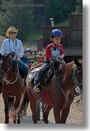 activities, america, boys, childrens, clothes, cowboy hat, hats, helmets, horseback riding, horses, idaho, north america, people, red horse mountain ranch, riding, united states, vertical, womens, photograph