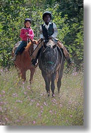 activities, america, boys, childrens, clothes, flowers, girls, hats, helmets, horseback riding, horses, idaho, nature, north america, people, red horse mountain ranch, riding, united states, vertical, wildflowers, photograph