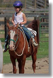 activities, america, childrens, clothes, girls, hats, helmets, horseback riding, horses, idaho, north america, people, red horse mountain ranch, riding, united states, vertical, photograph