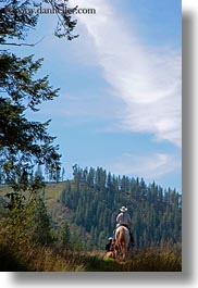 activities, america, clothes, cowboy hat, hats, horseback riding, horses, idaho, north america, people, red horse mountain ranch, riding, united states, vertical, photograph