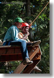 activities, america, boys, childrens, clothes, hats, helmets, idaho, ledge, north america, people, red horse mountain ranch, tree climb, trees, united states, vertical, photograph