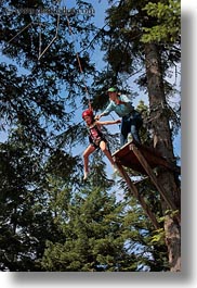 activities, america, childrens, clothes, from, girls, hats, helmets, idaho, jumping, north america, people, red horse mountain ranch, tree climb, trees, united states, vertical, photograph