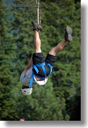 activities, america, clothes, from, hats, helmets, idaho, men, nature, north america, plants, red horse mountain ranch, swinging, trees, united states, vertical, zip line, zipline, photograph