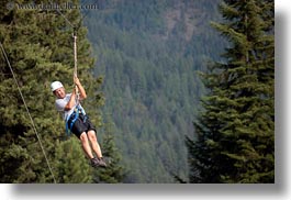 activities, america, clothes, from, hats, helmets, horizontal, idaho, men, nature, north america, plants, red horse mountain ranch, swinging, trees, united states, zip line, zipline, photograph