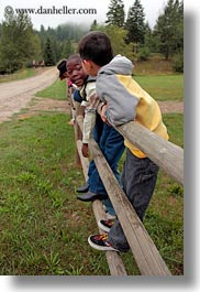 america, boys, childrens, fences, idaho, north america, people, red horse mountain ranch, united states, vertical, photograph