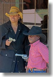 america, boys, childrens, christian, clothes, cowboy hat, fight, guns, hats, idaho, laura, mothers, north america, people, red horse mountain ranch, straw hat, united states, vertical, womens, photograph