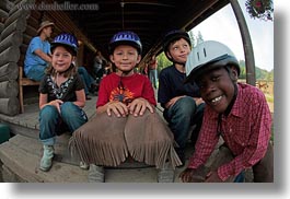 america, boys, childrens, clothes, emotions, fisheye lens, girls, happy, hats, helmets, horizontal, idaho, north america, people, red horse mountain ranch, smiles, stables, united states, photograph