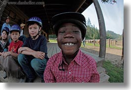 america, boys, childrens, clothes, emotions, fisheye lens, happy, hats, helmets, horizontal, idaho, north america, people, red horse mountain ranch, smiles, stables, united states, photograph